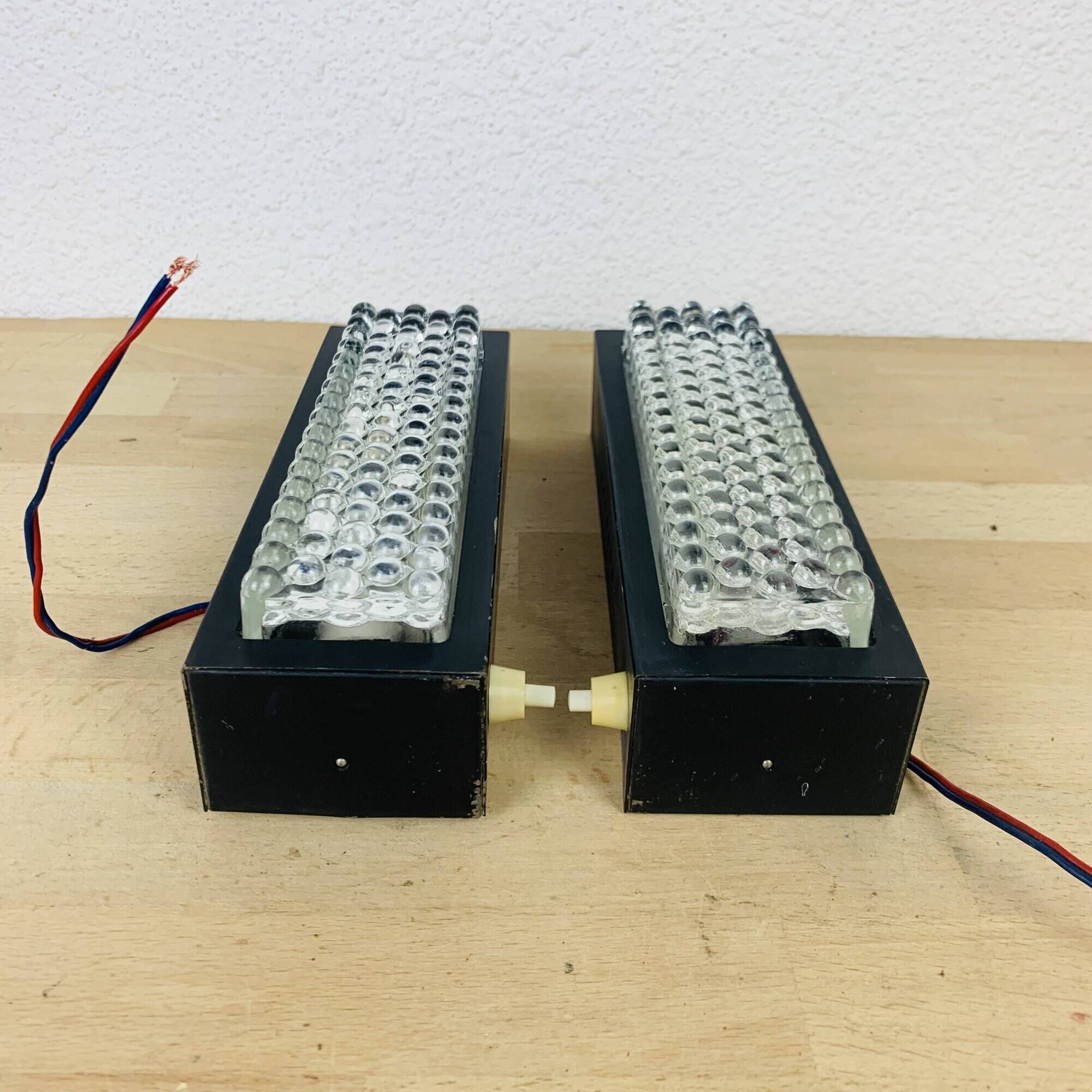 Pair of molded glass and metal wall lights from the 1950s