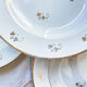 4 assiettes creuses l’amandinoise en porcelaine blanche dorées motif fleuris