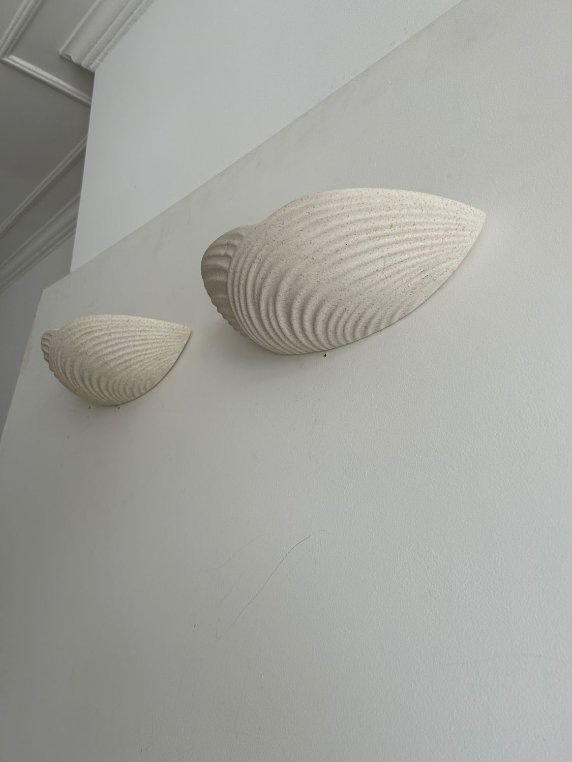 Pair of wall lamps in molded plaster France 1980
