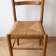 Set of 8 vintage wooden chairs with rush seats.