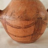 Antique oriental clay pitcher.