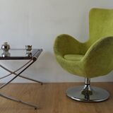 Bucket seat in chrome and green.