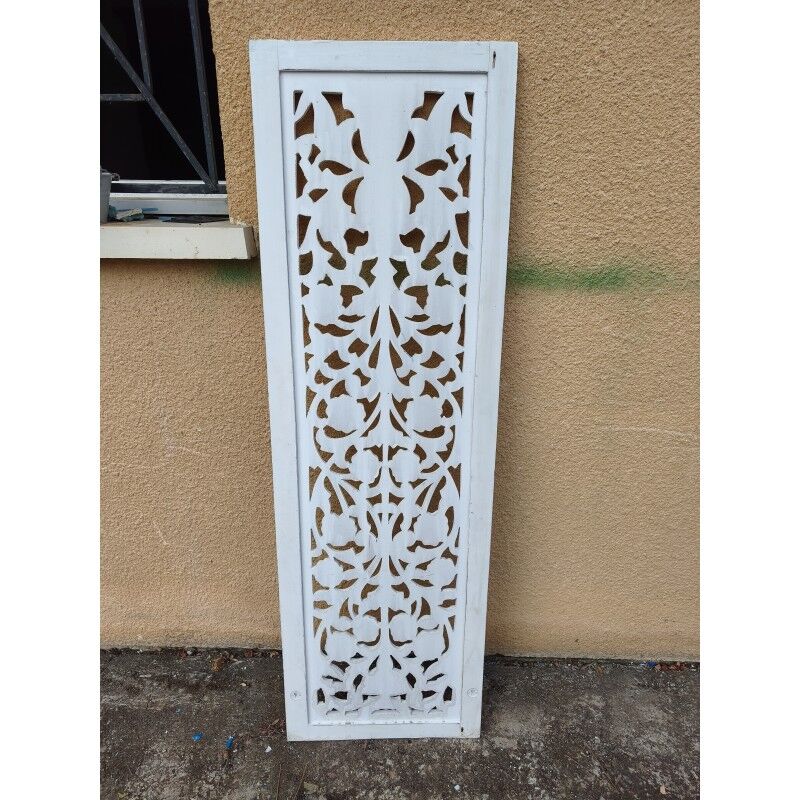 Decorative wooden panel with carved and openwork design.