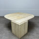 Table basse travertin forme œil par Roche Bobois