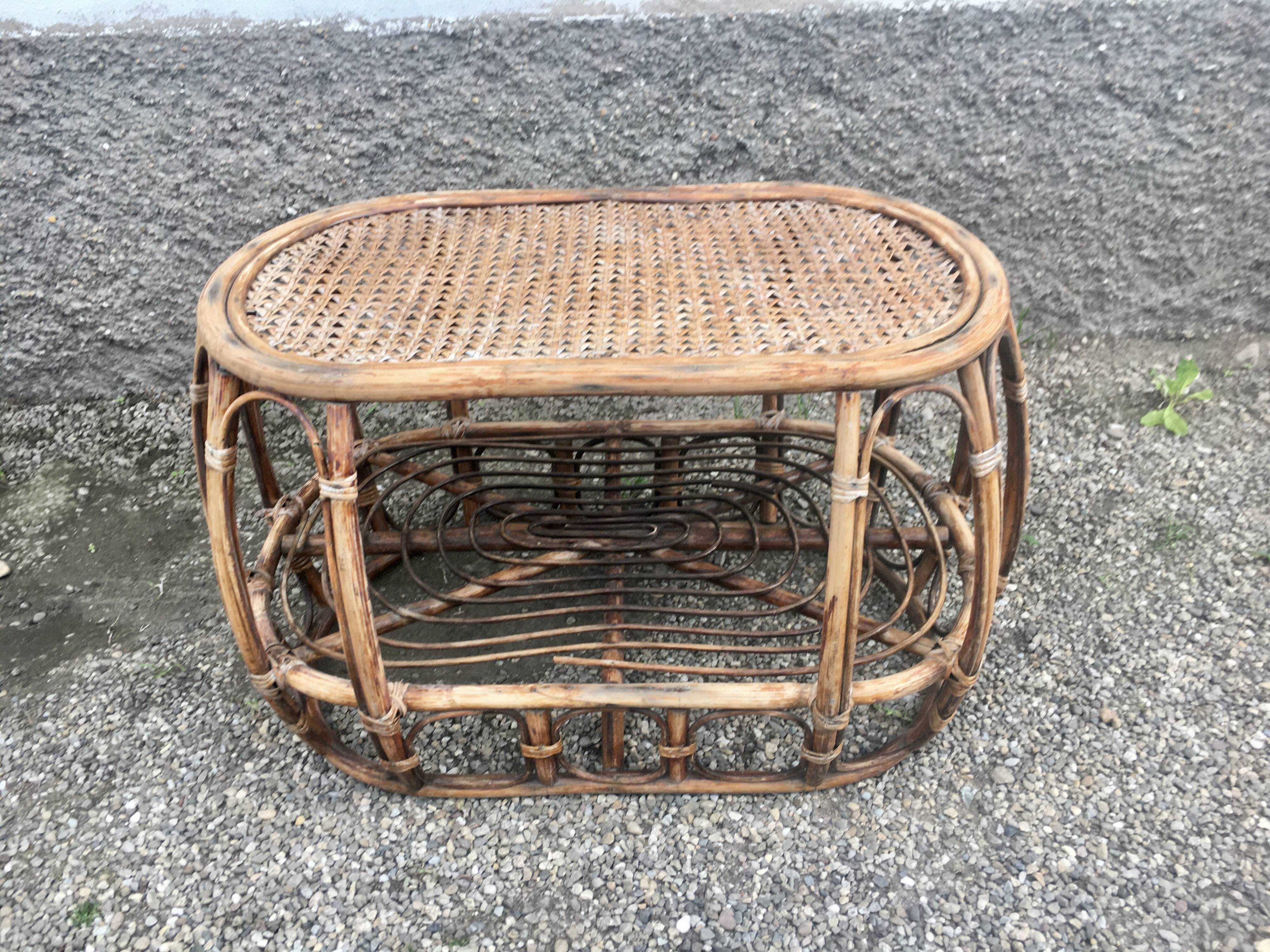 Pair of rattan armchairs and vintage oval table