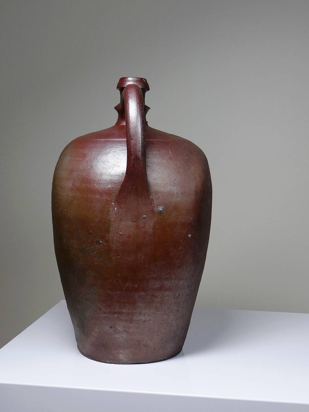 Large stoneware jar from Normandy with lustrous burgundy glaze, from the 1920s-30s.