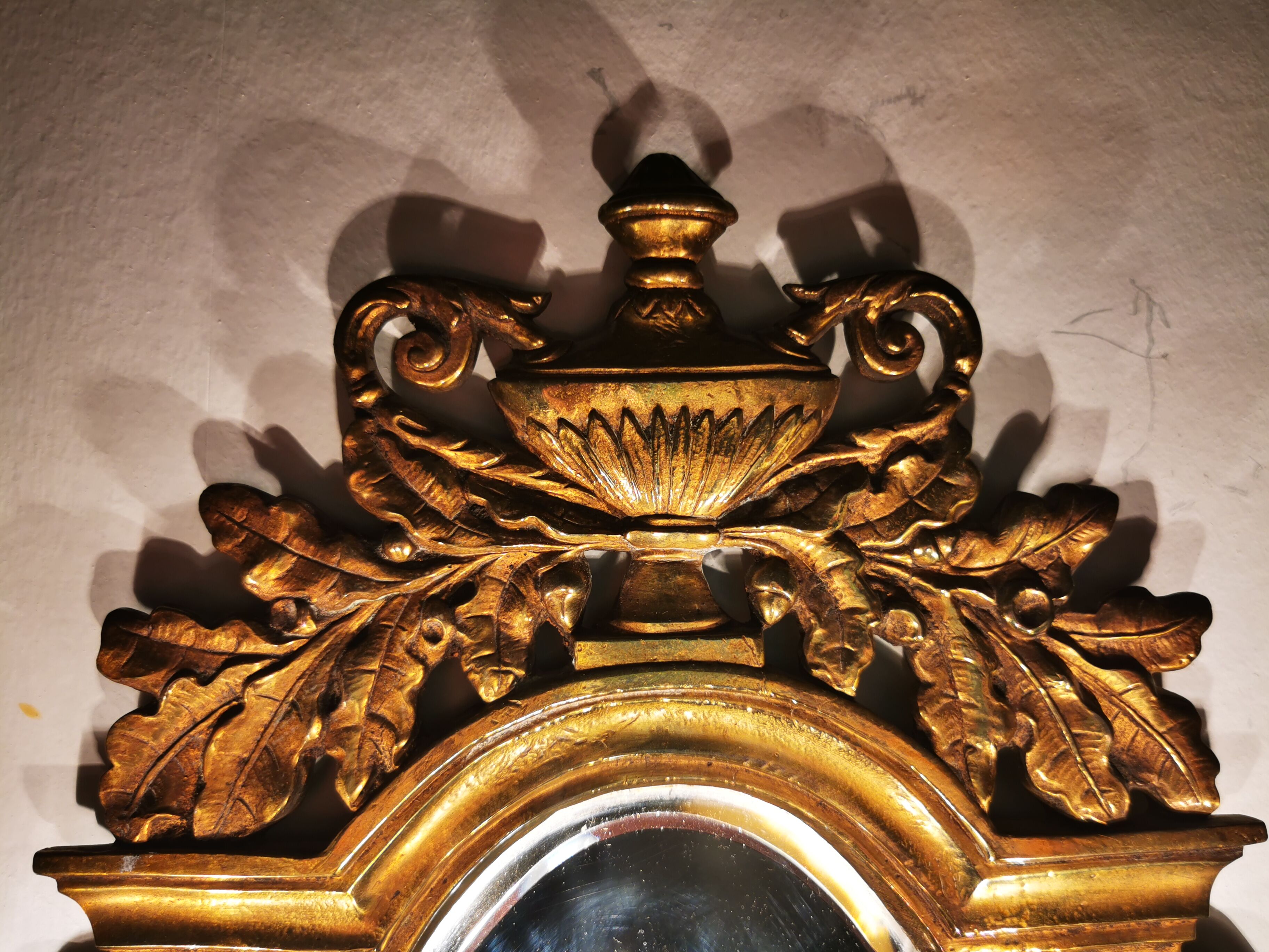 Pair of chissed and gilded bronze mirrors forming appliques