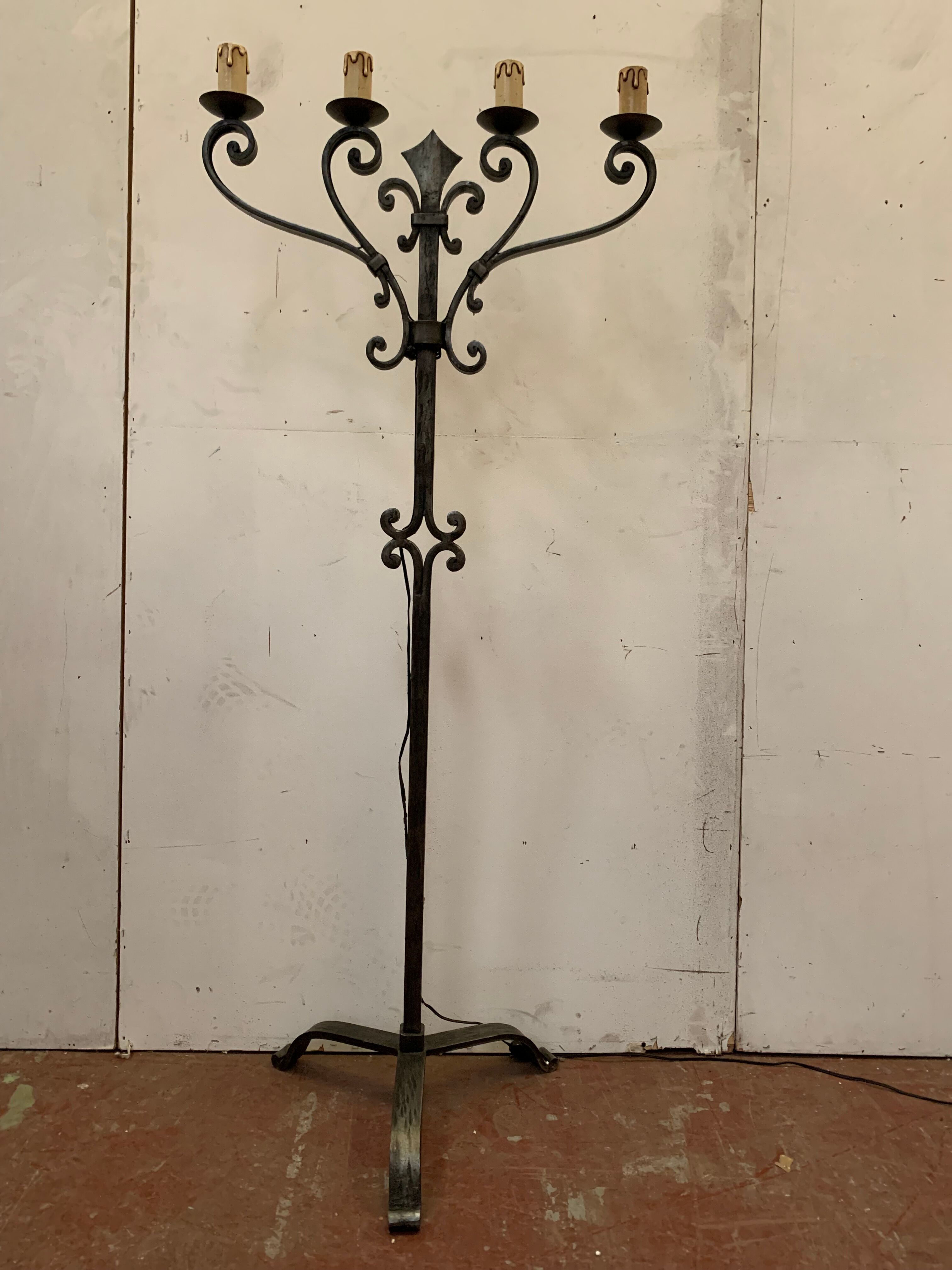 Floor lamp has four wrought iron lights