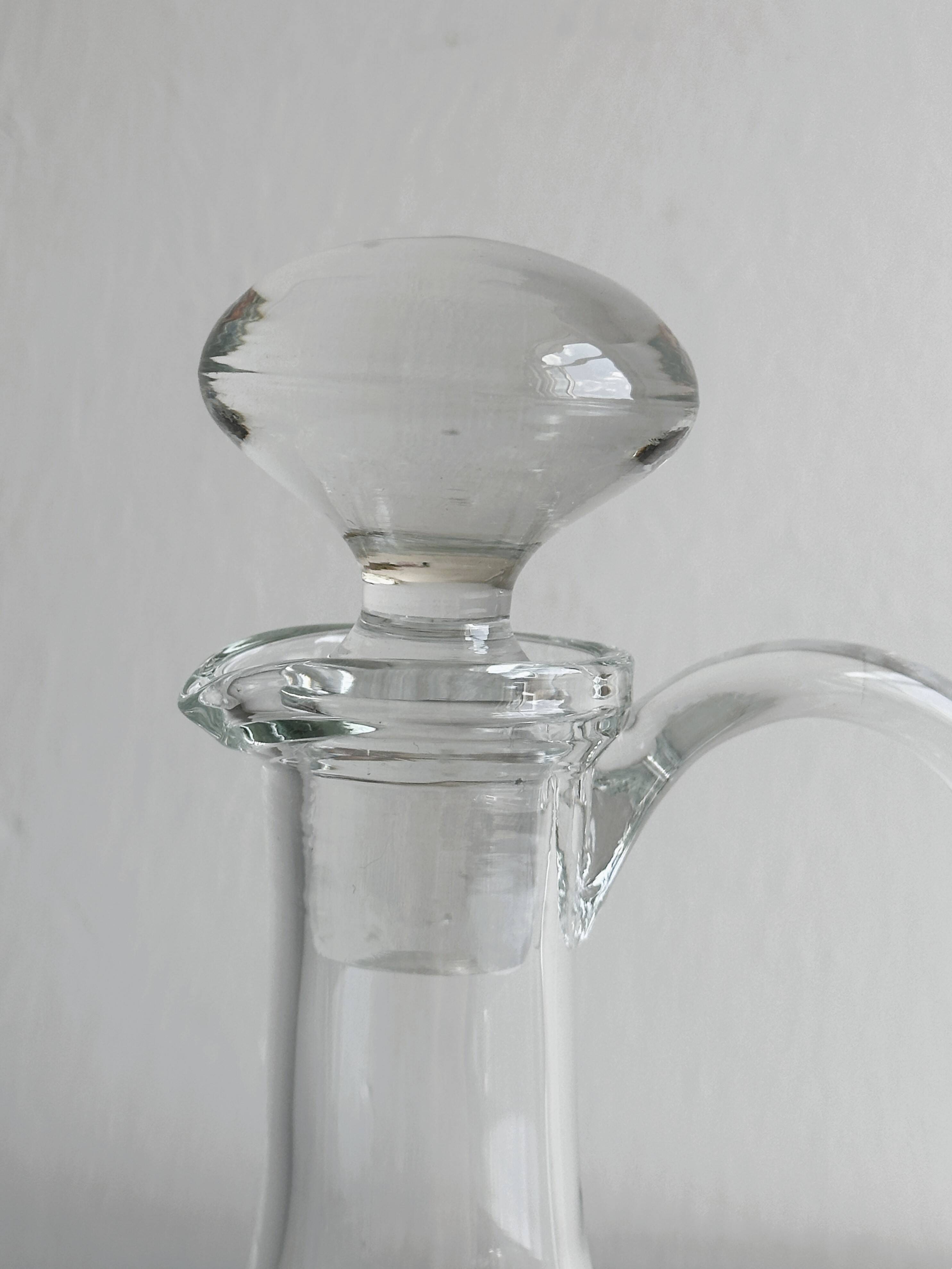Mouth-blown glass carafe, old glassware.