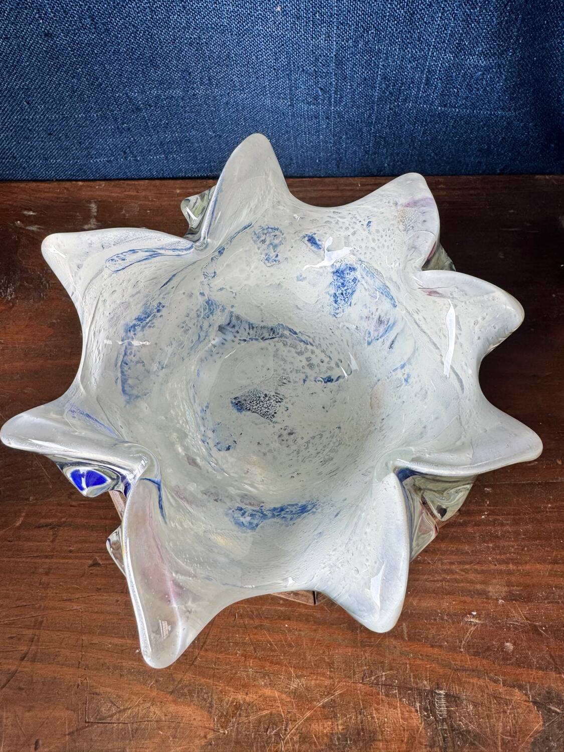 Multi-layer glass ashtray with metallic oxide inclusions.