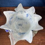 Multi-layer glass ashtray with metallic oxide inclusions.