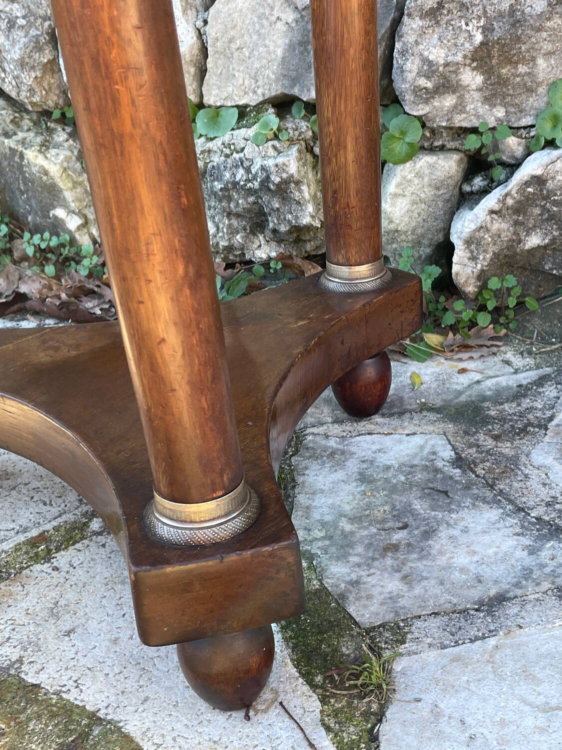 Empire style mahogany and mahogany veneer tripod pedestal table