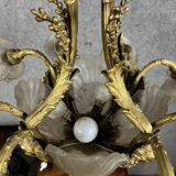 Rare and important gilded bronze chandelier with shells and roses.
