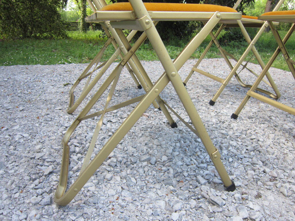 Série de 4 chaises pliantes métal doré et tissus