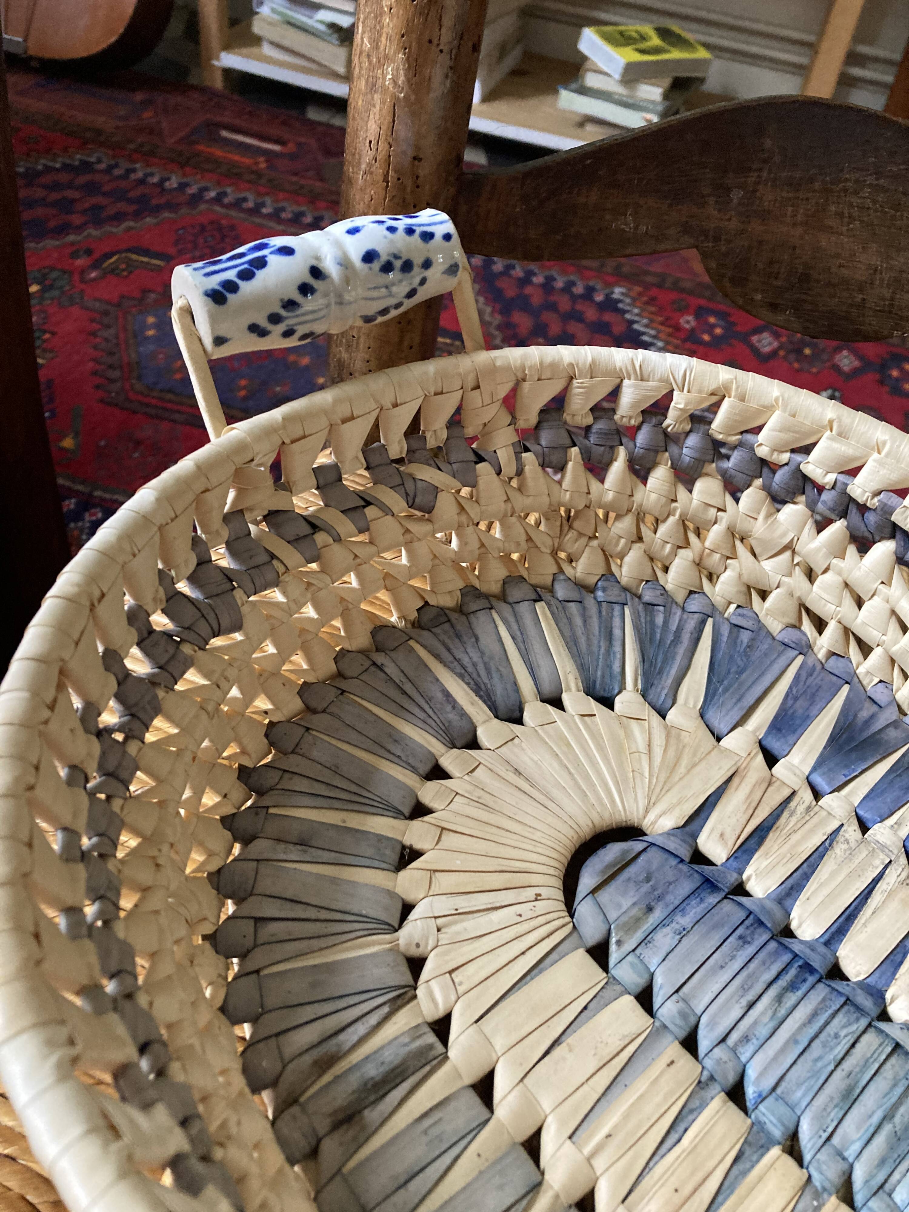 Wicker basket and vintage asymmetrical antique ceramic