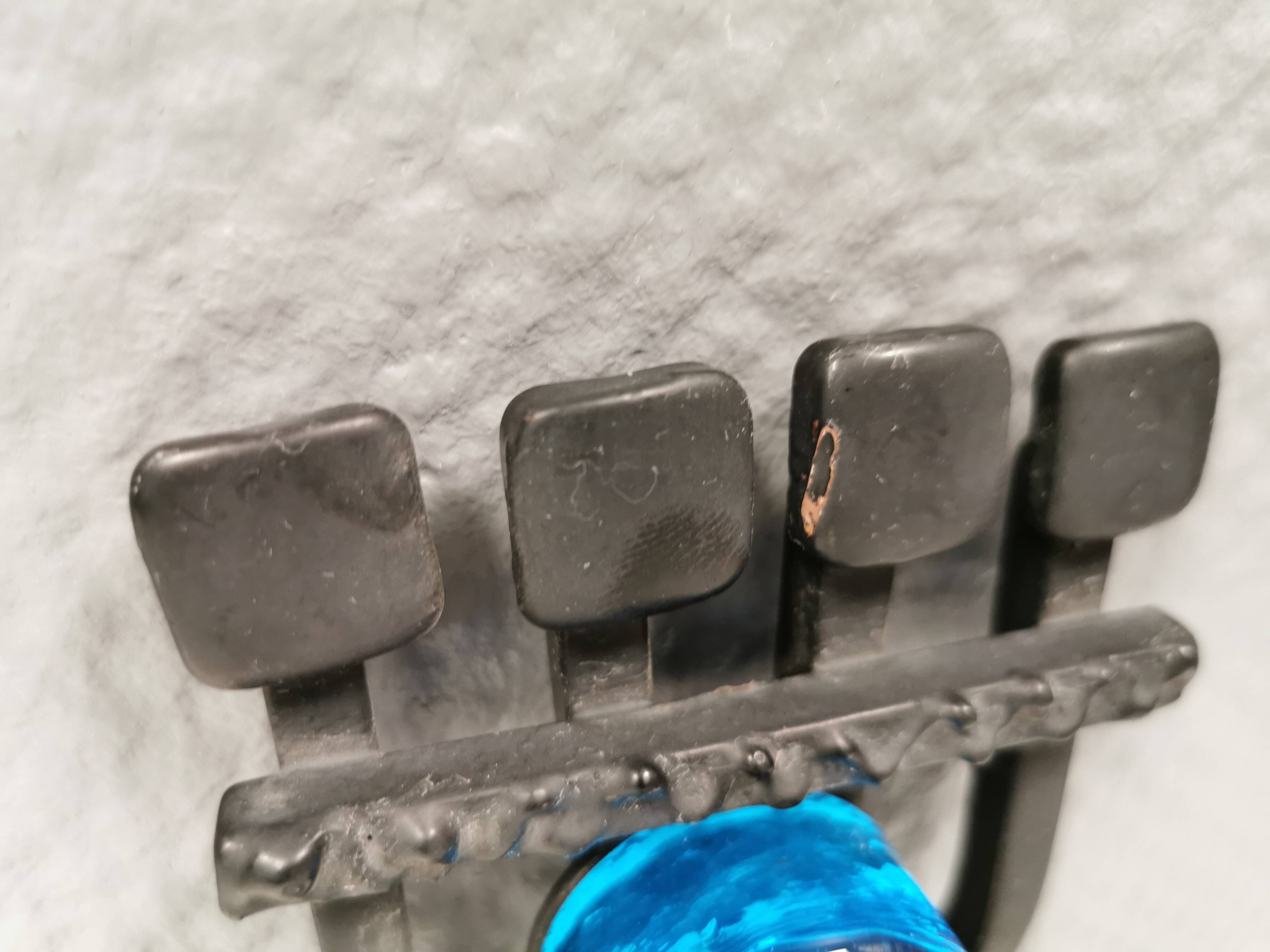 Vintage wall candle holder in wrought iron and hard pressed blue glass.