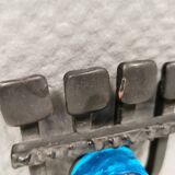 Vintage wall candle holder in wrought iron and hard pressed blue glass.