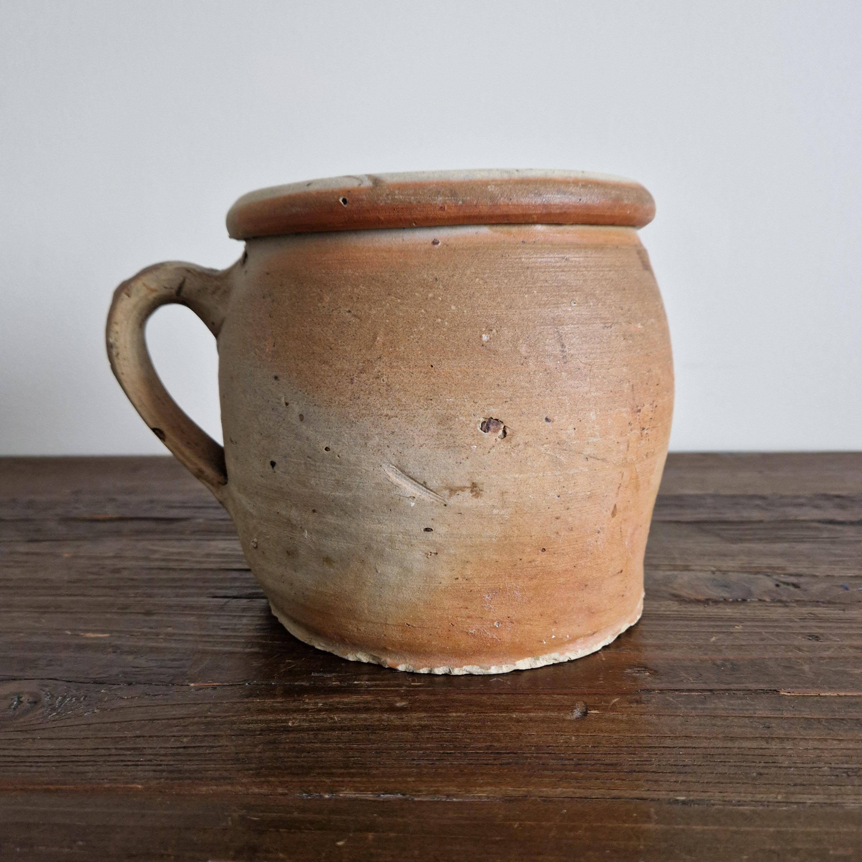 Ancient terracotta pot with a handle