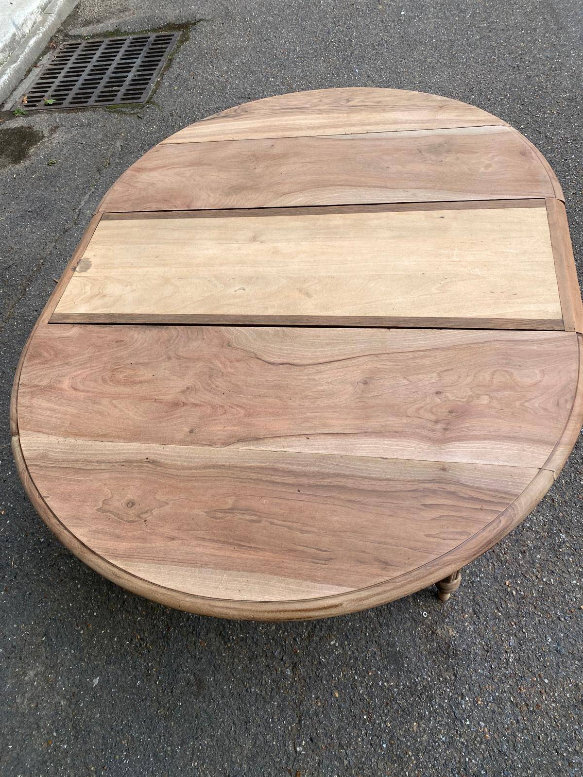 Renovated 18th century solid wood extendable round dining table with shutters