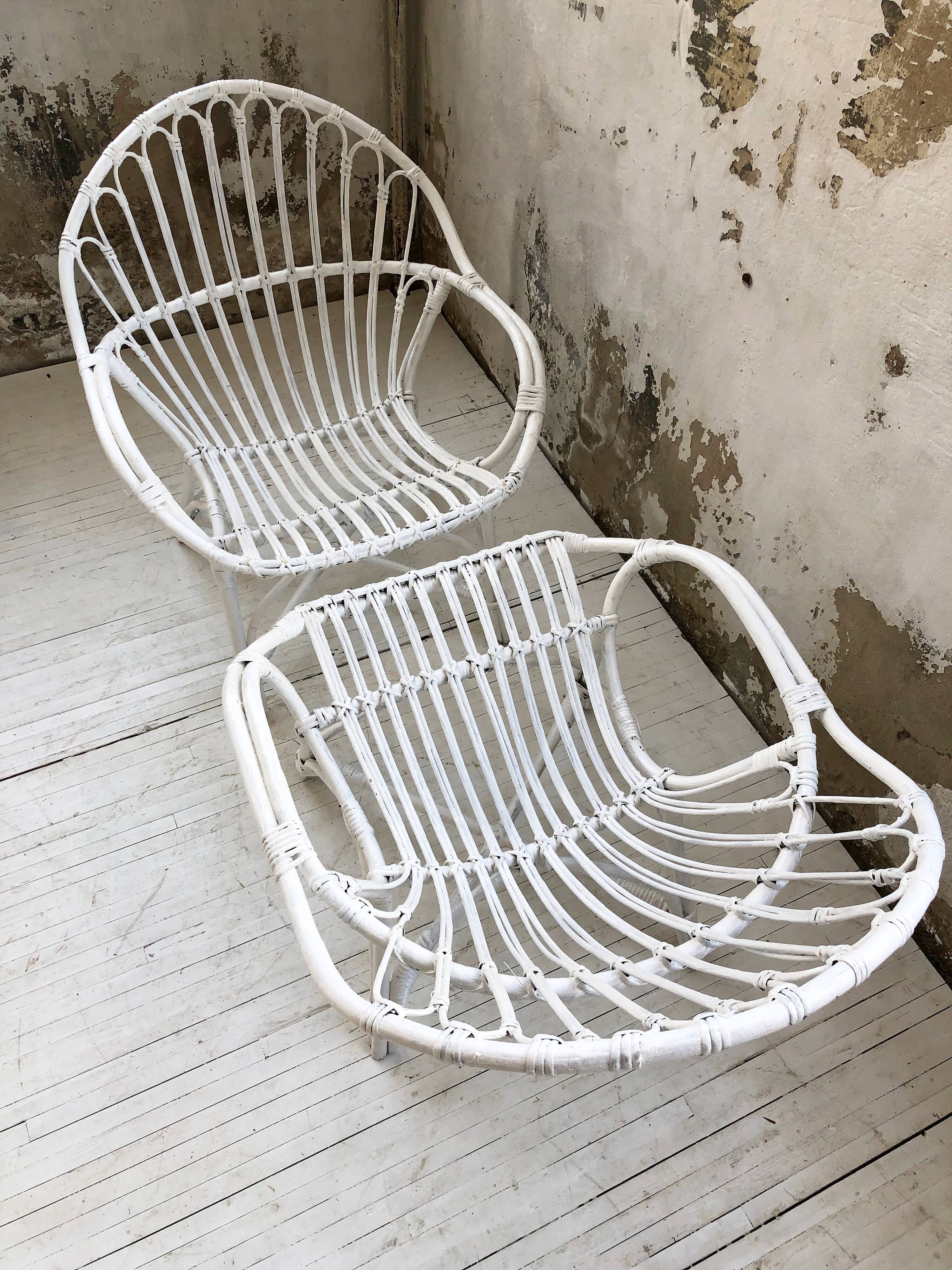 Pair of white rotin armchairs