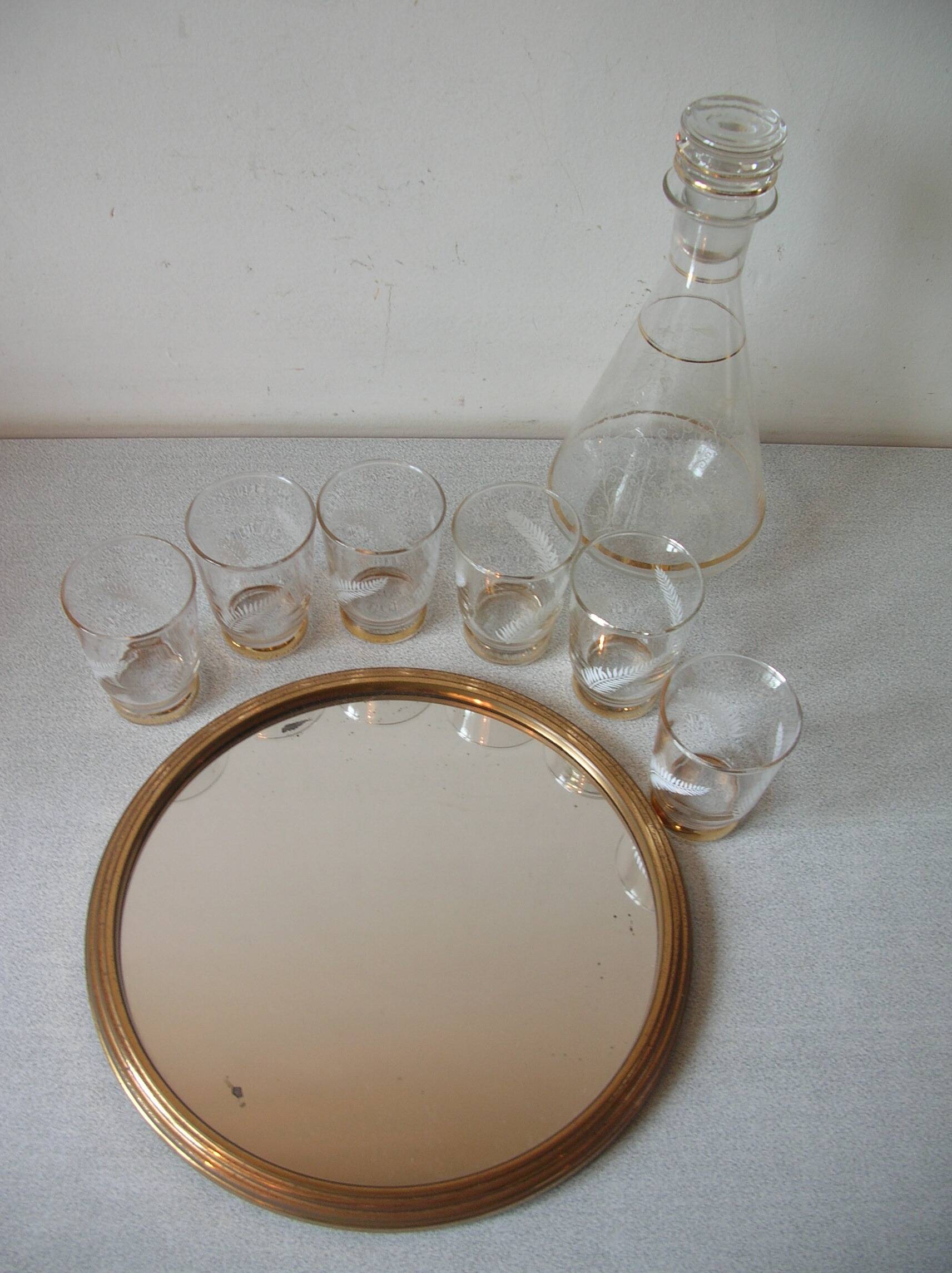 Old glass carafe liquor service with gilding vintage ice mirror tray