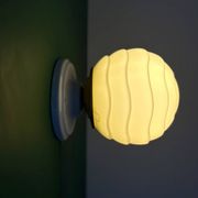 Vintage Art Deco globe wall light in pale yellow opaline.