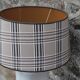 White ceramic lamp with tartan shade – cozy and timeless style