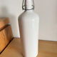 Old white ceramic bottle