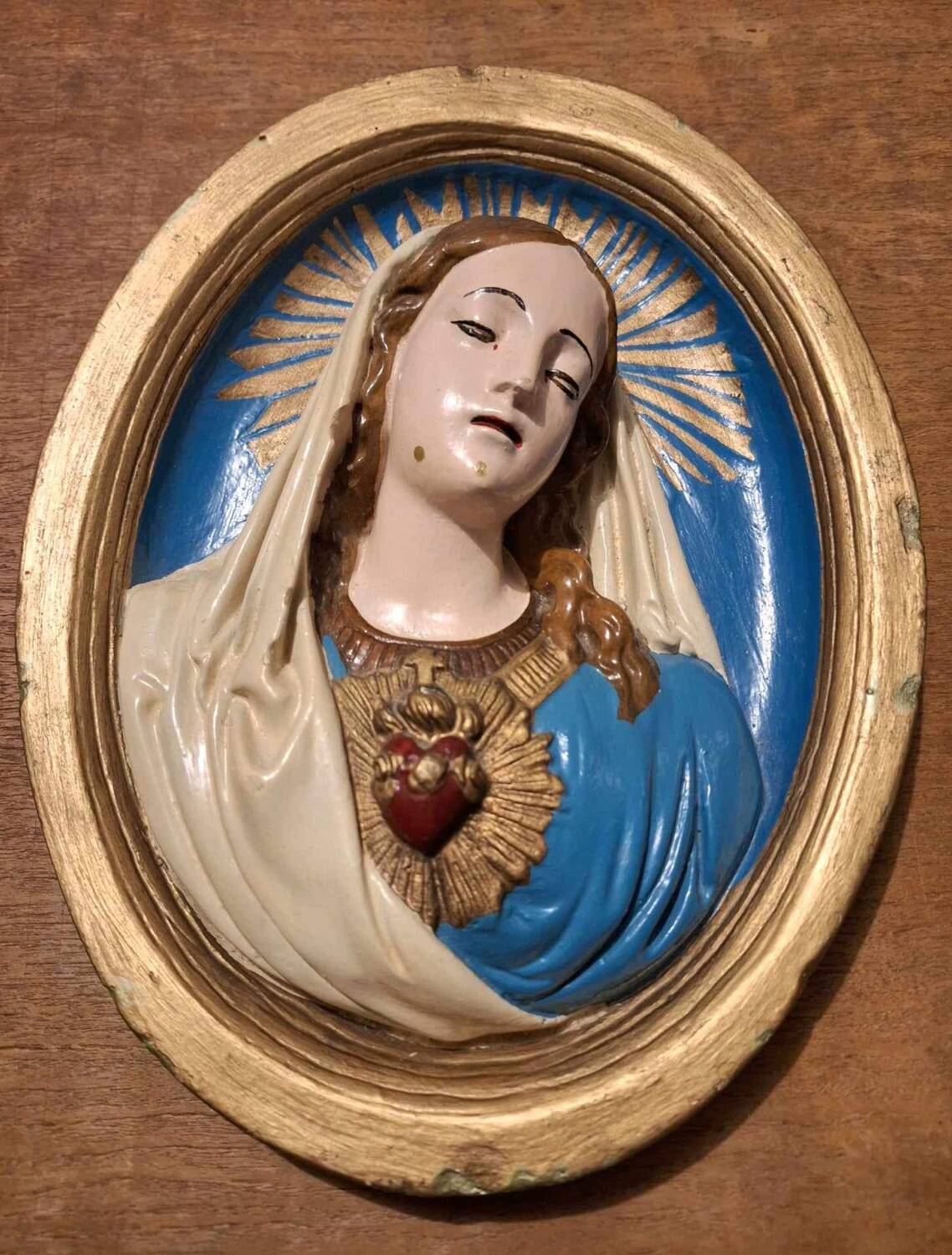 Vintage frame of the Virgin in plaster, old religious painting