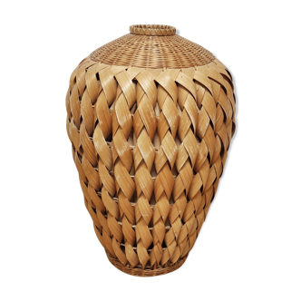 Vase in braided bamboo leaves