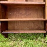 Old carved wooden medicine cabinet with beveled mirror