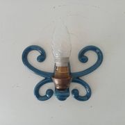 Antique wall light in enamelled cast iron.