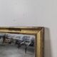 Rectangular mirror with a gold wooden frame.