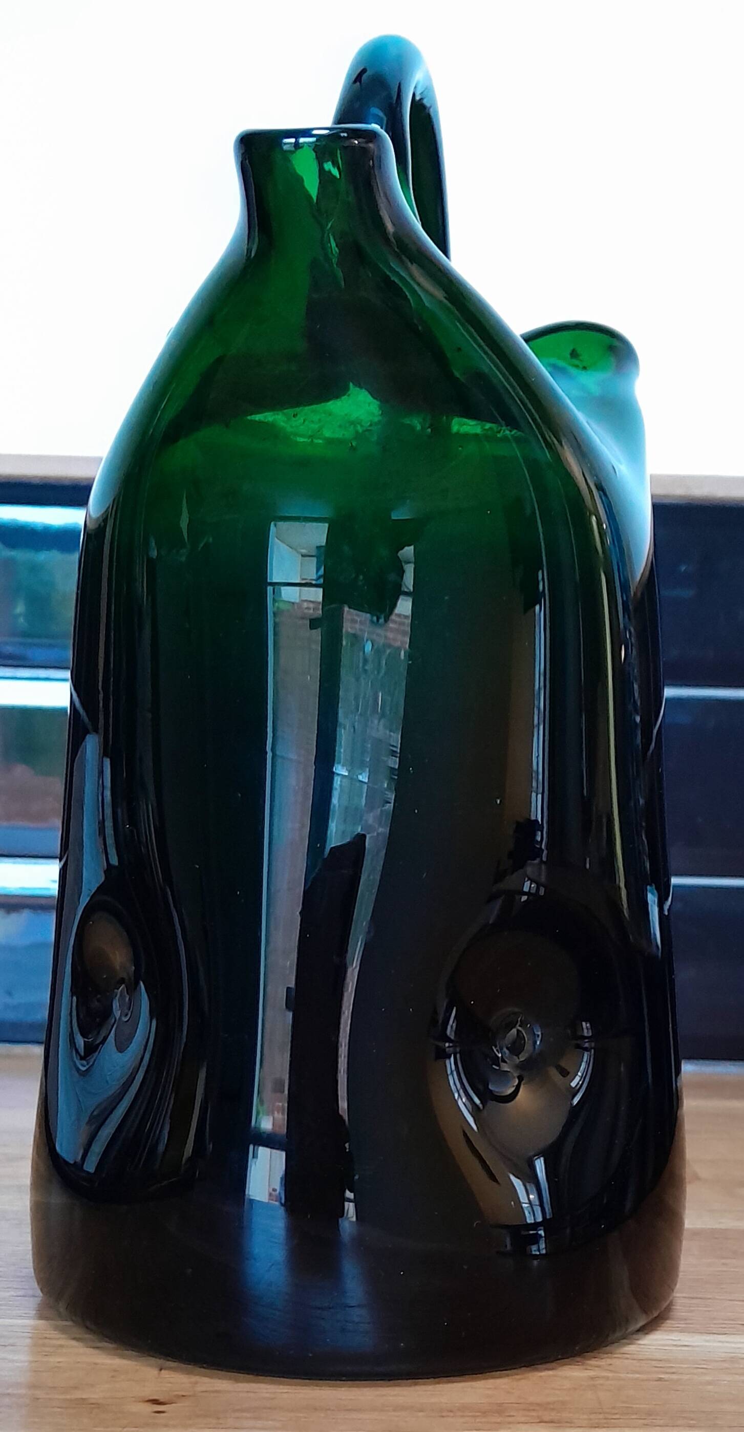 Blown glass pitcher filled