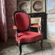 Napoleon III medallion armchair in carved wood and red velvet.