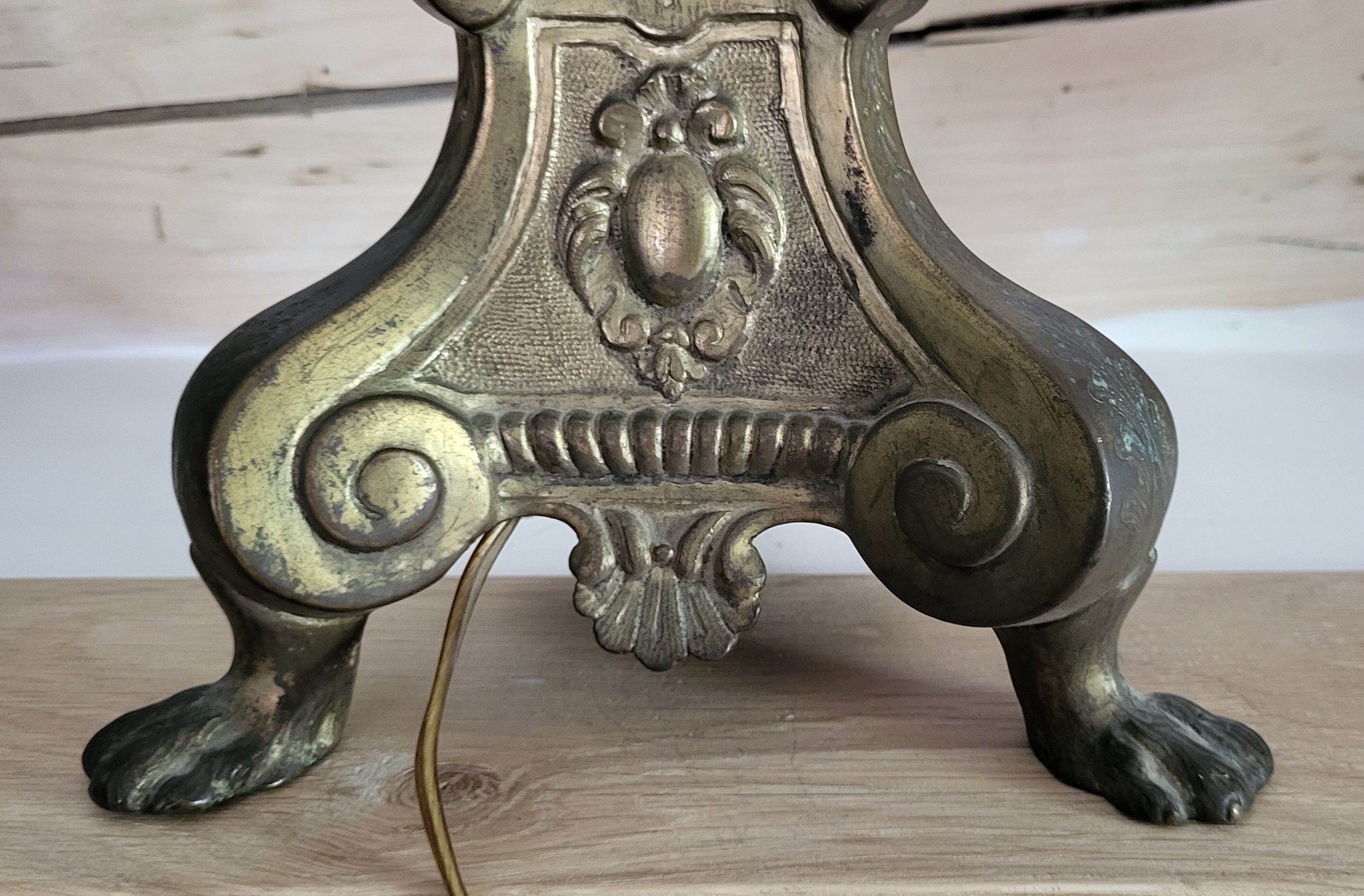 Gold metal tripod lamp