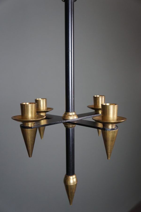 Candle holder in black metal and brass