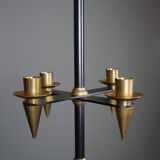 Candle holder in black metal and brass