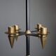 Candle holder in black metal and brass