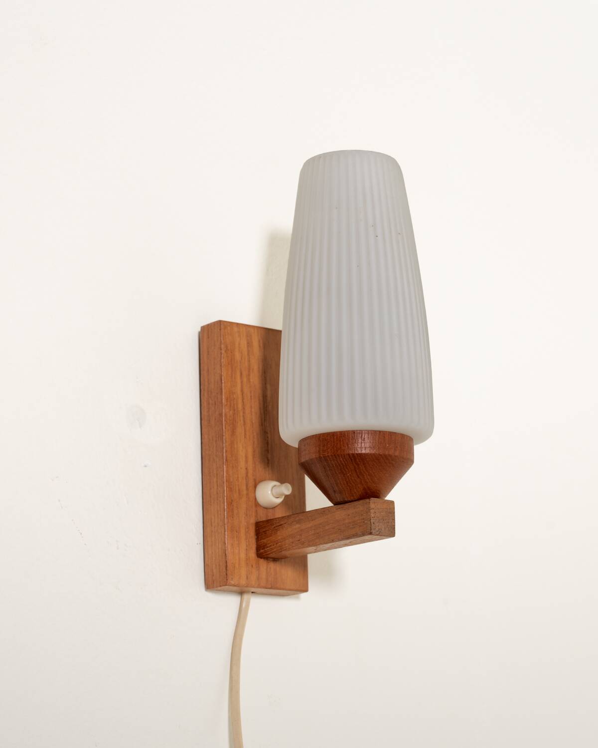 Pair of teak and opaline glass wall lamps, 1950s/1960s