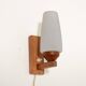 Pair of teak and opaline glass wall lamps, 1950s/1960s