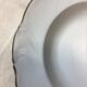 Hollow porcelain plates of pure white and gold