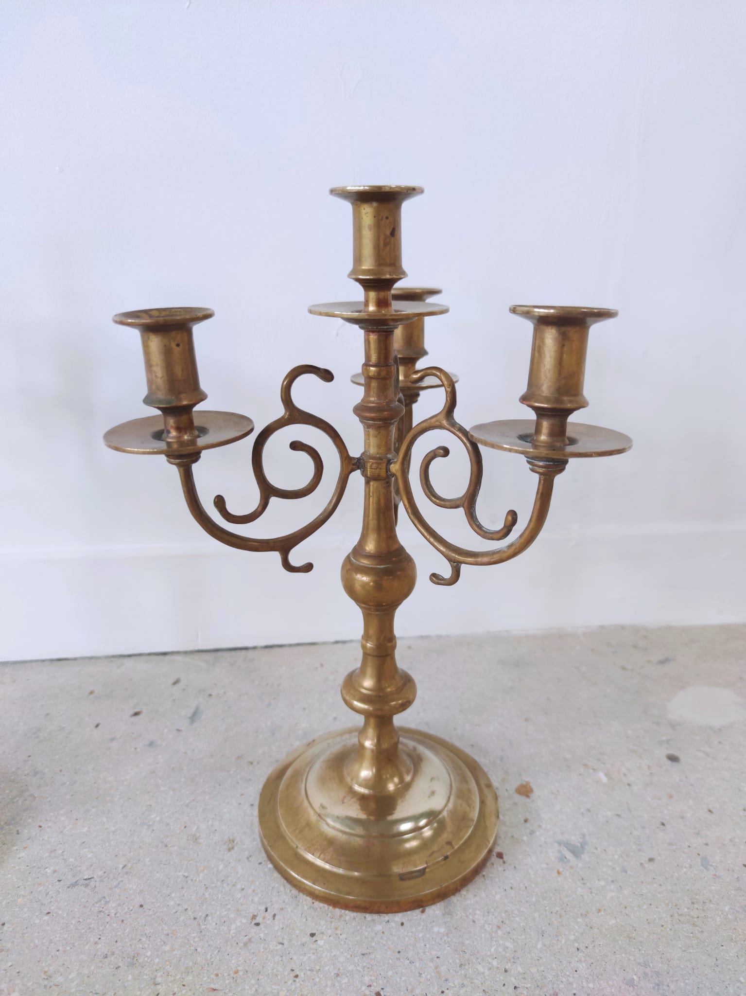 Pair of four-light candle holders in gilded brass