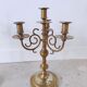 Pair of four-light candle holders in gilded brass