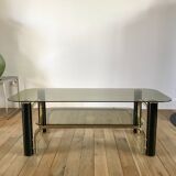 coffee table in smoked glass and black and gold metal from the 70s
