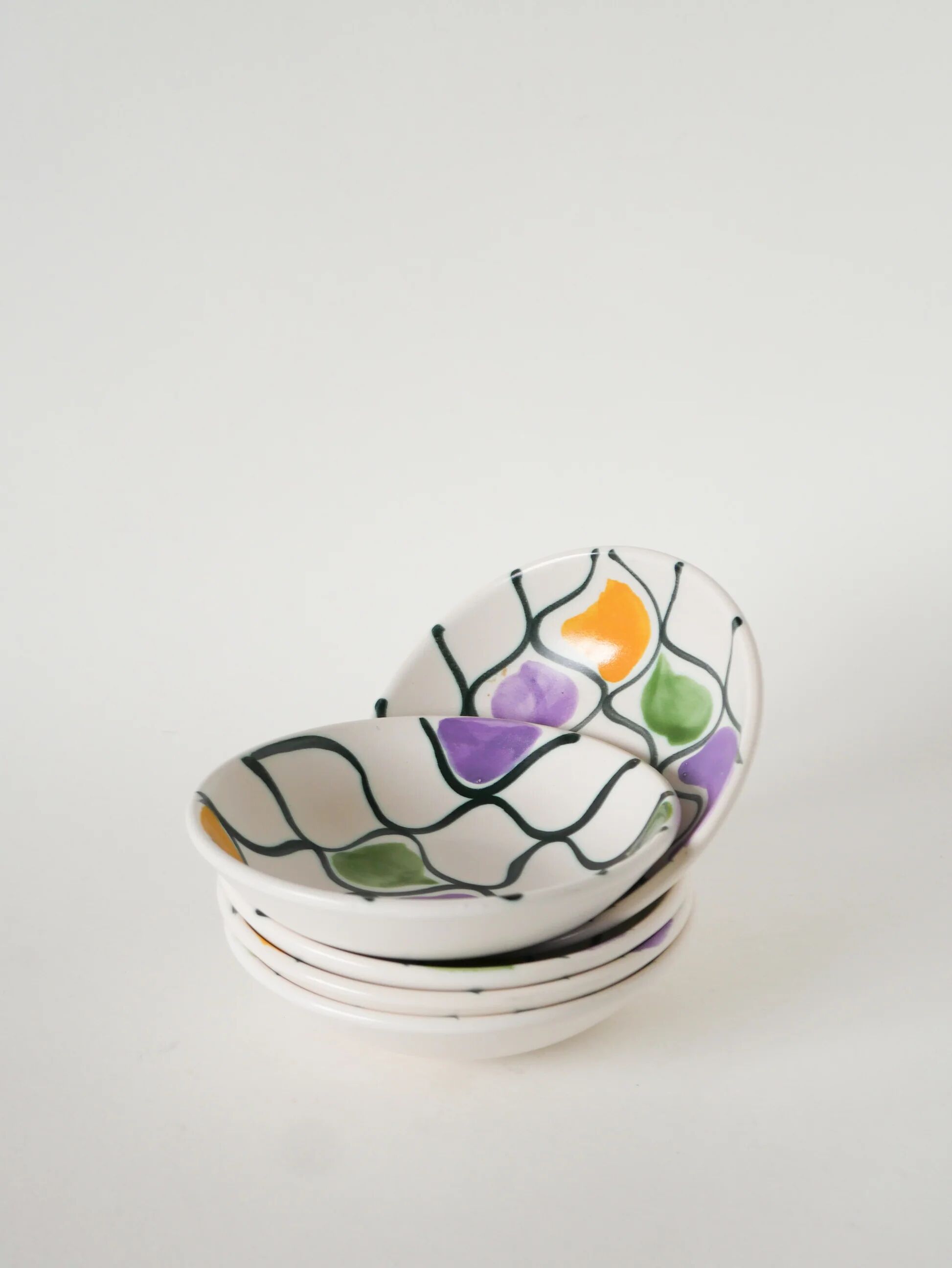 Pair of ceramic ramekins, abstract patterns in yellow, purple, and green, Pornic model, 1960.