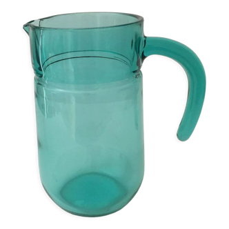 Clear glass jug in emerald green color