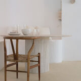 Omega circular dining table in natural travertine