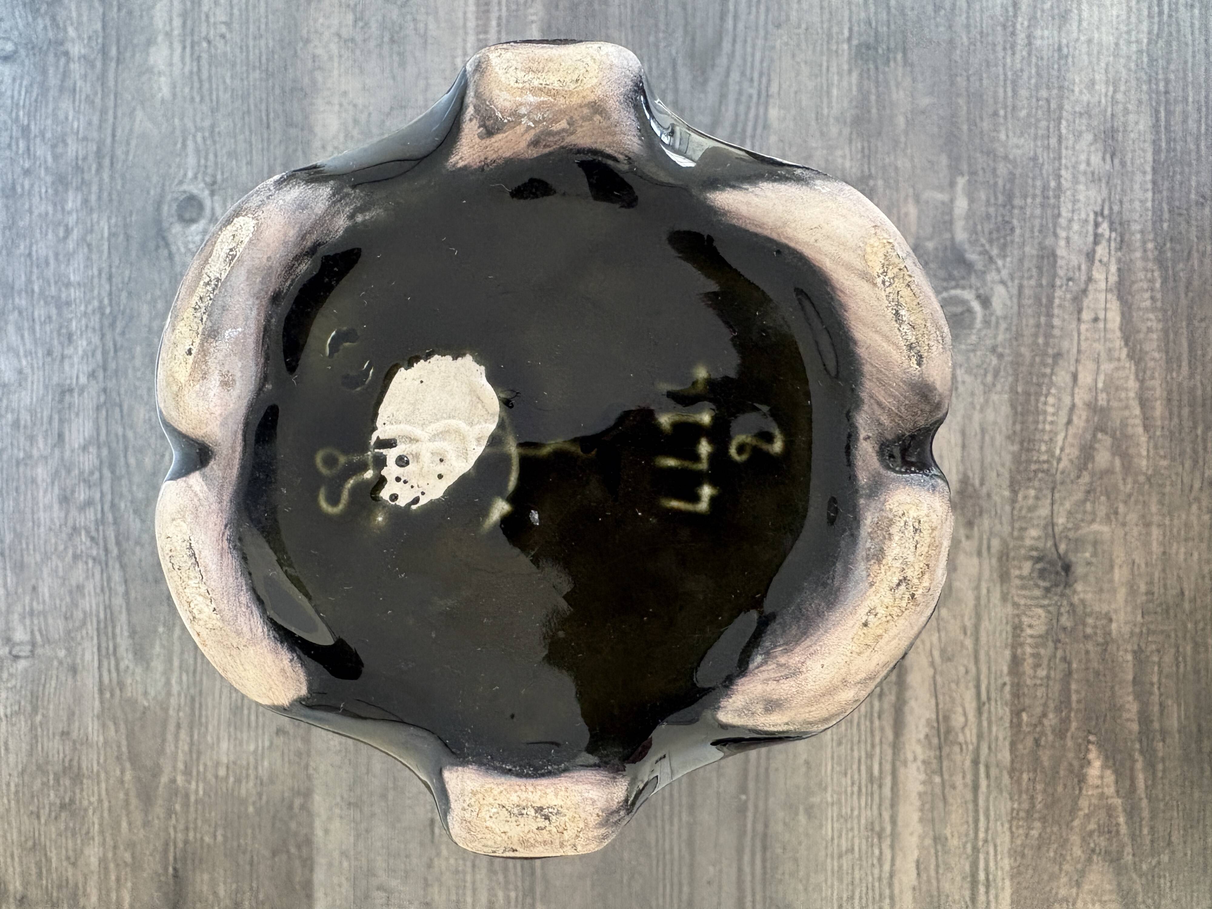 Antique ceramic vase by De Bruyn with floral decoration.