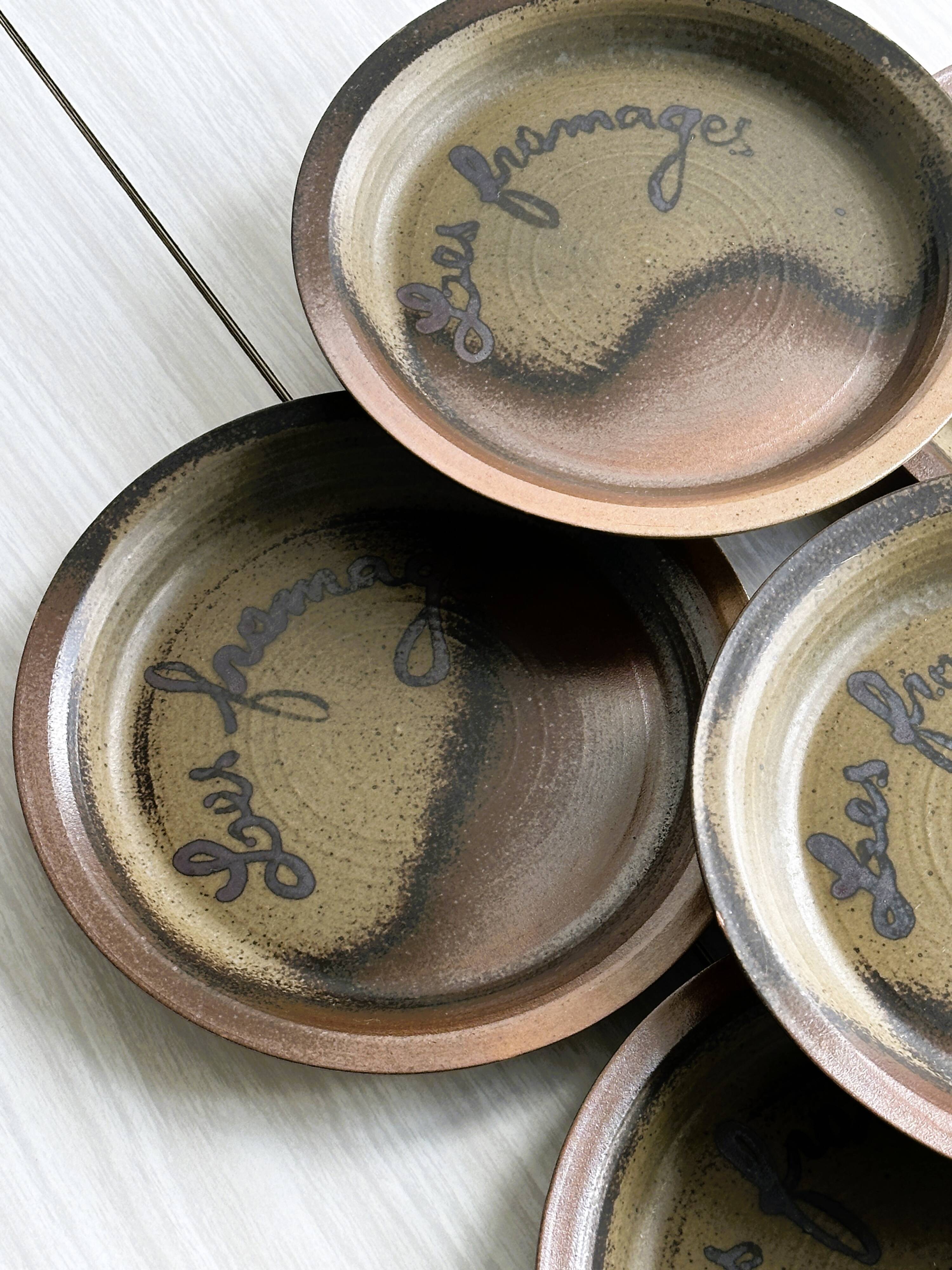 6 Arnon stoneware cheese plates.